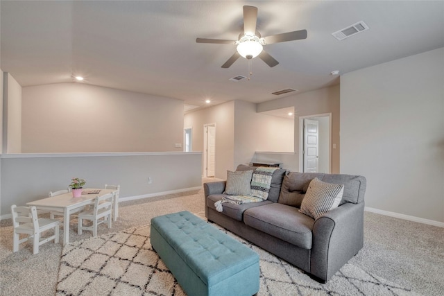 living room featuring light colored carpet and ceiling fan