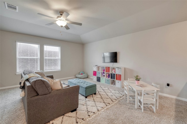 living room with vaulted ceiling, light carpet, and ceiling fan