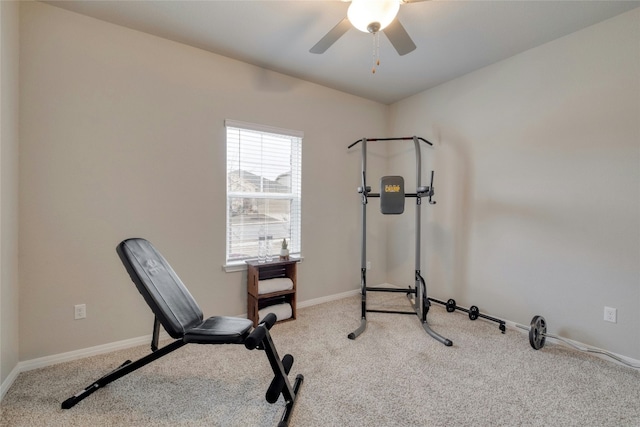 exercise room featuring ceiling fan and light colored carpet