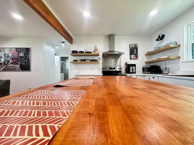 living area with recessed lighting and beamed ceiling