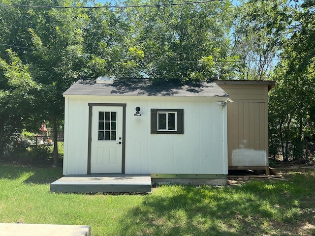 view of shed featuring fence