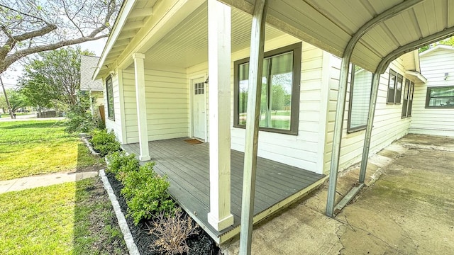 view of home's exterior with a yard and covered porch