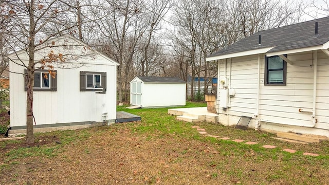 view of yard with a storage shed and an outdoor structure