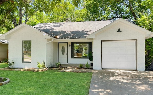 ranch-style home with a garage and a front lawn