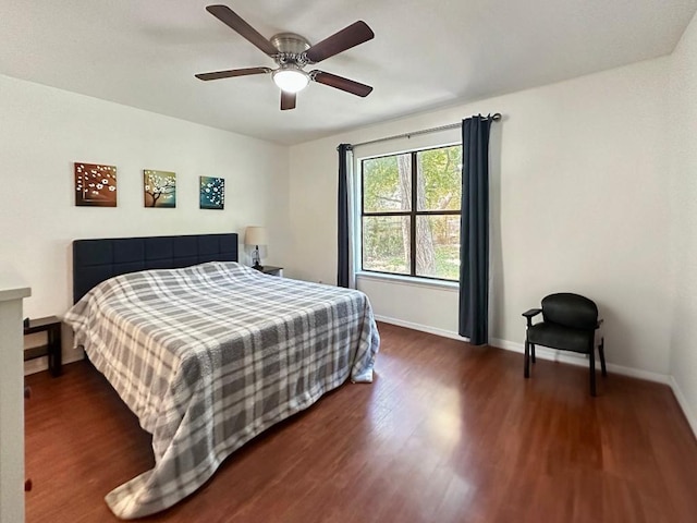 bedroom featuring ceiling fan and dark hardwood / wood-style floors