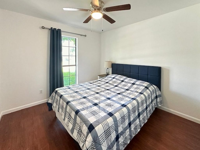 bedroom with ceiling fan and dark hardwood / wood-style floors