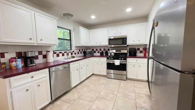 kitchen featuring white cabinetry, appliances with stainless steel finishes, and sink