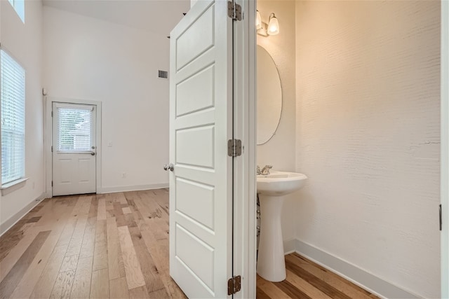 bathroom featuring wood-type flooring