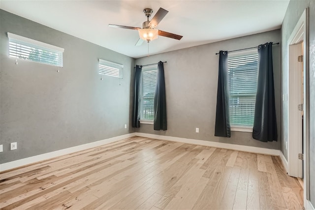 empty room featuring ceiling fan and light wood-type flooring