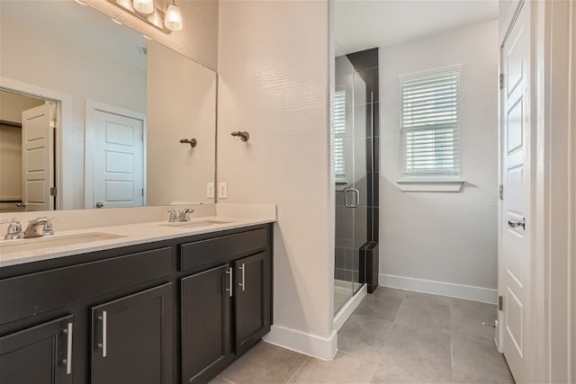 bathroom featuring walk in shower, vanity, and tile patterned flooring