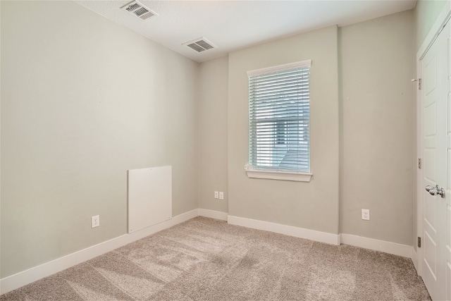 unfurnished room with carpet