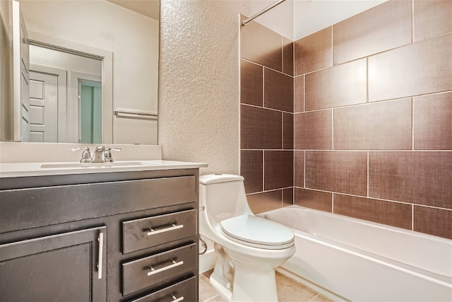 full bathroom with tiled shower / bath, vanity, toilet, and tile patterned flooring