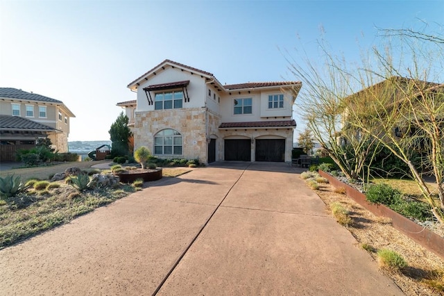 mediterranean / spanish-style home featuring a garage