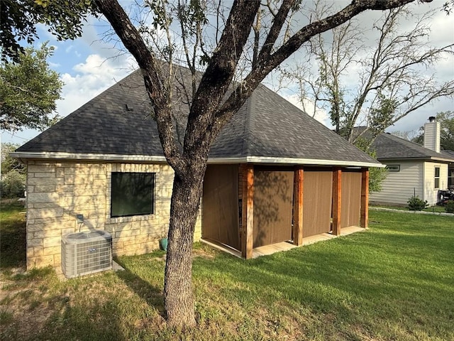 view of outdoor structure with central AC unit