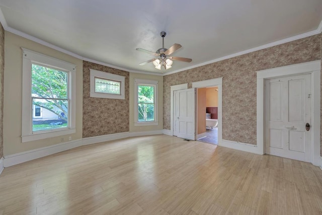 interior space with crown molding, ceiling fan, and light hardwood / wood-style flooring