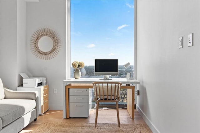 44 E Ave Unit 2310, Austin, TX 78701 - office area with light wood finished floors and baseboards