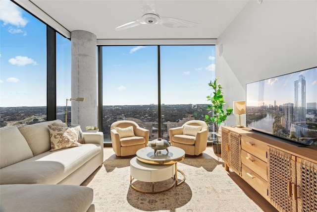 living room with hardwood / wood-style flooring and floor to ceiling windows