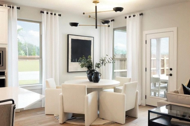 dining space featuring light wood-type flooring