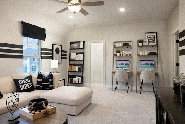 living room featuring ceiling fan, vaulted ceiling, and carpet