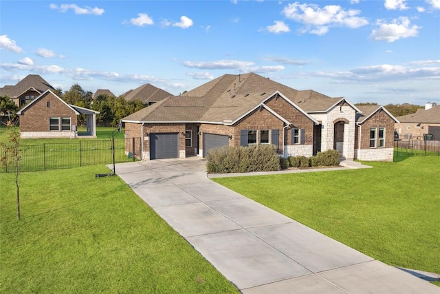 view of front of home with a garage and a front yard