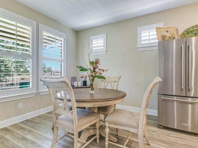 115 Lafayette St, Georgetown, TX 78633 - dining room featuring plenty of natural light, baseboards, and light wood-style floors