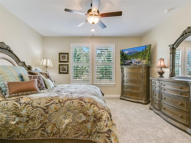 115 Lafayette St, Georgetown, TX 78633 - bedroom featuring light colored carpet, a ceiling fan, and baseboards