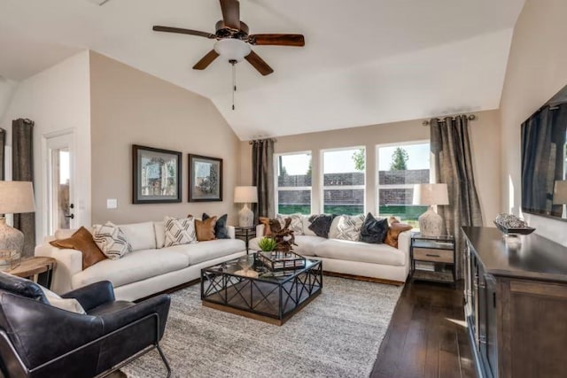 living room featuring ceiling fan, dark hardwood / wood-style flooring, and vaulted ceiling