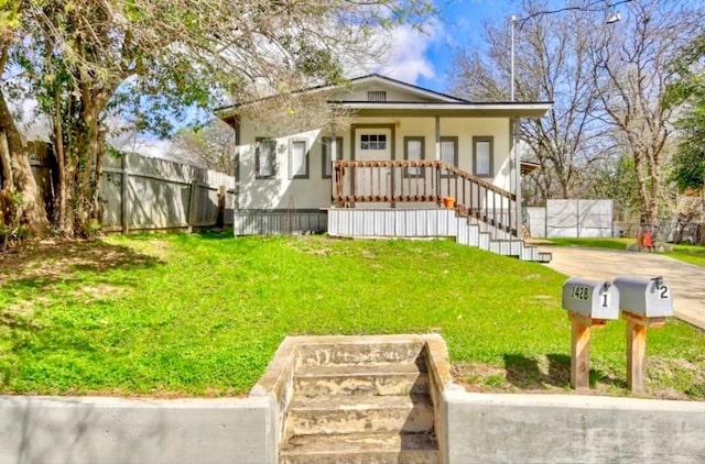 view of front of house with a porch and a front lawn