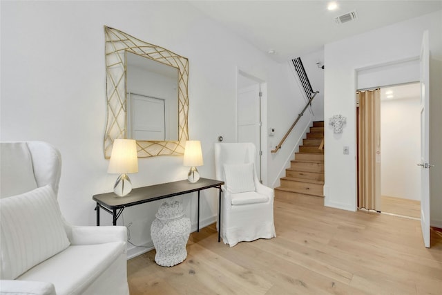 sitting room with light hardwood / wood-style floors