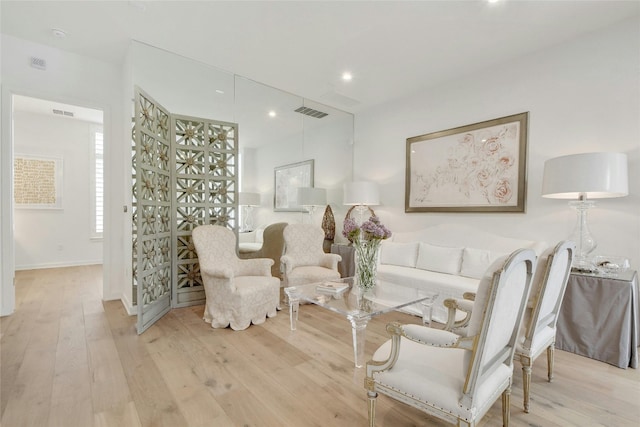 living area with light hardwood / wood-style floors