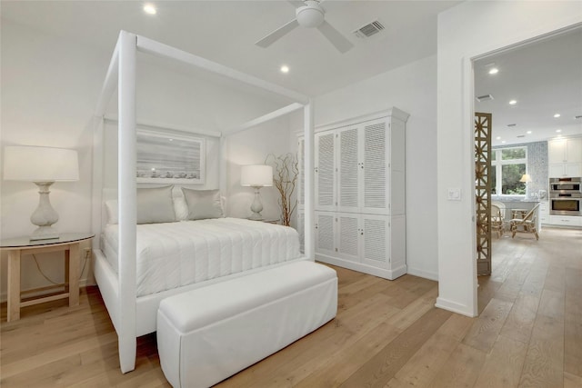 bedroom featuring ceiling fan and light wood-type flooring