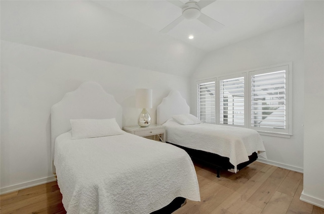 bedroom featuring ceiling fan, lofted ceiling, and light hardwood / wood-style floors