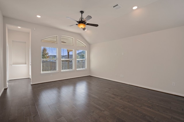 unfurnished room with ceiling fan, lofted ceiling, and dark hardwood / wood-style flooring