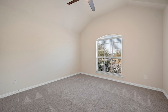 spare room featuring vaulted ceiling, ceiling fan, and carpet floors