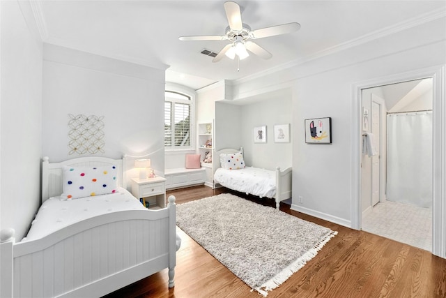 bedroom featuring wood-type flooring, ceiling fan, and crown molding