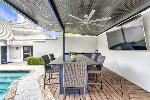 exterior space with ceiling fan