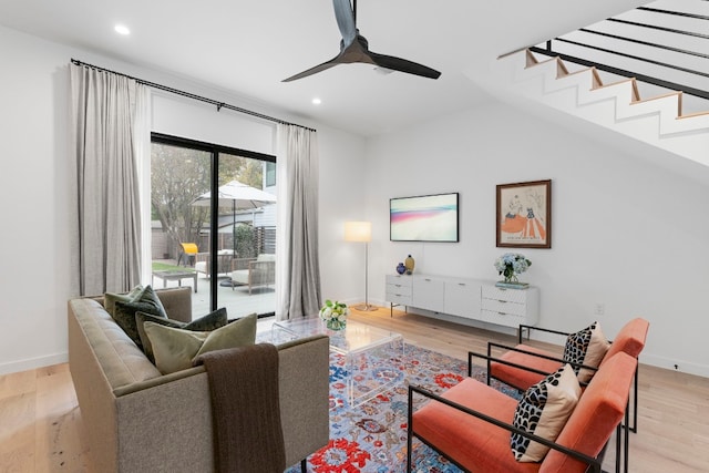 living room with baseboards, light wood finished floors, a ceiling fan, and recessed lighting