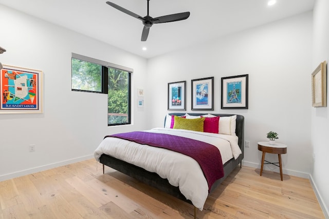 bedroom featuring recessed lighting, baseboards, ceiling fan, and light wood finished floors