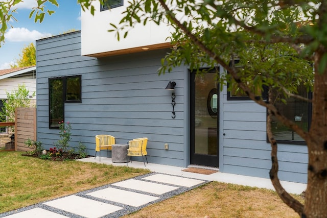 exterior space with a lawn and a patio area