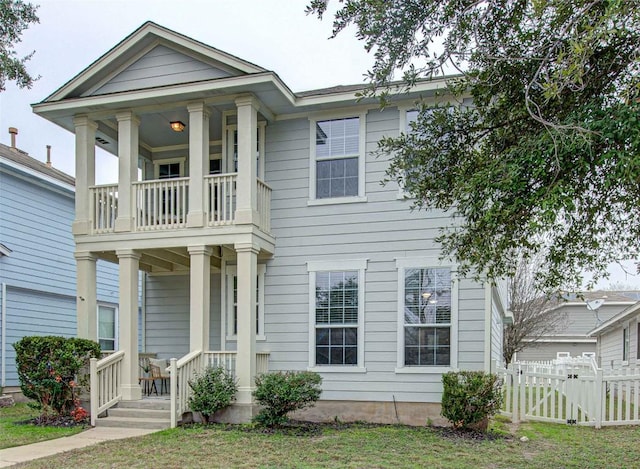 greek revival house with a balcony