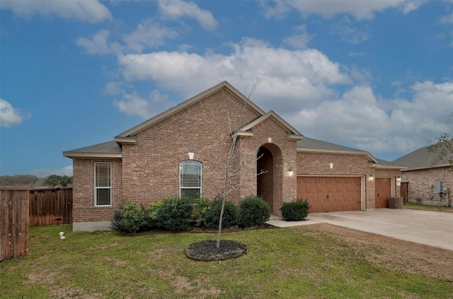 1228 Brenham Ln, Leander, TX 78641 - view of front of property with brick siding, an attached garage, and driveway