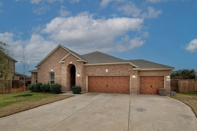 view of front of home featuring a garage and a front lawn