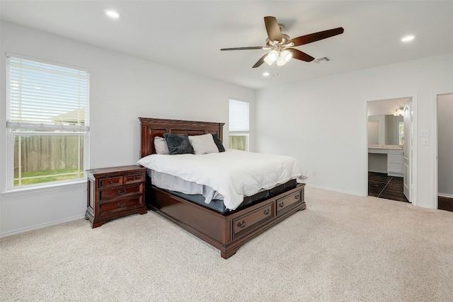 1228 Brenham Ln, Leander, TX 78641 - carpeted bedroom with baseboards, recessed lighting, ceiling fan, and ensuite bathroom