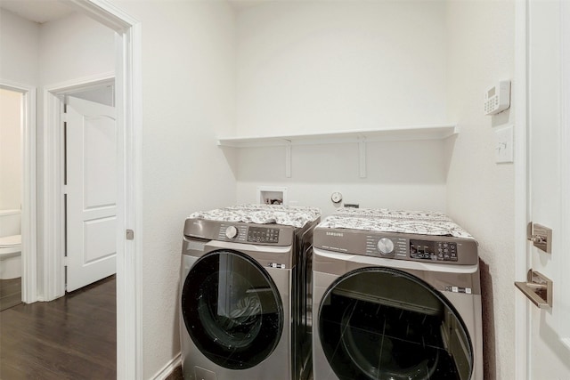 1228 Brenham Ln, Leander, TX 78641 - washroom featuring washer and clothes dryer, dark wood-style floors, and baseboards