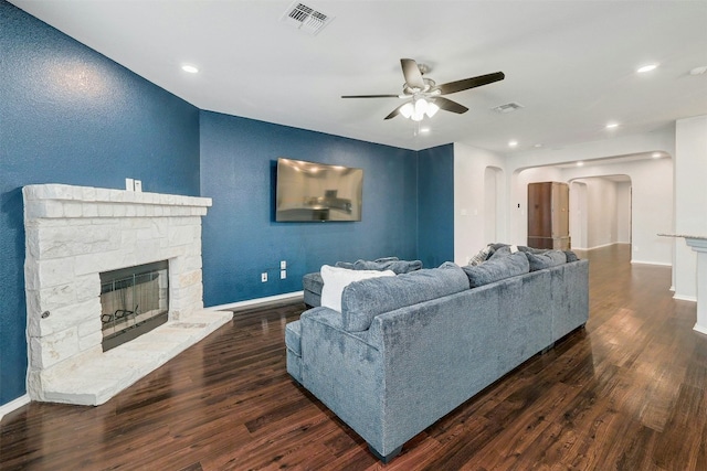 1228 Brenham Ln, Leander, TX 78641 - living room featuring arched walkways, ceiling fan, wood finished floors, baseboards, and recessed lighting