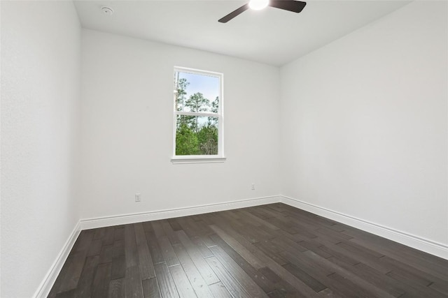 unfurnished room featuring dark hardwood / wood-style floors and ceiling fan