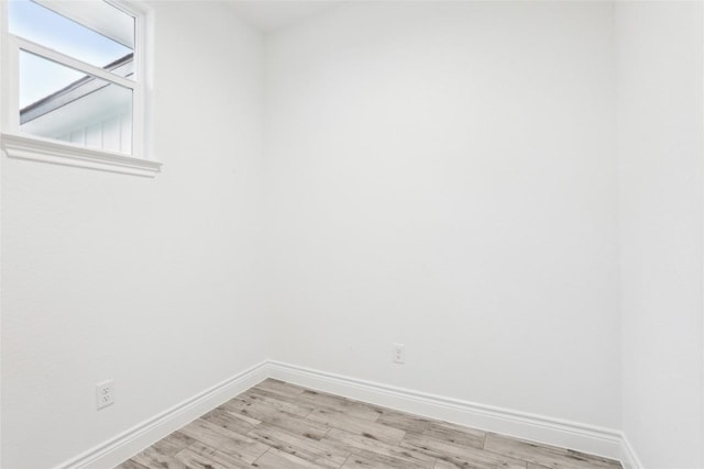 spare room featuring light hardwood / wood-style floors