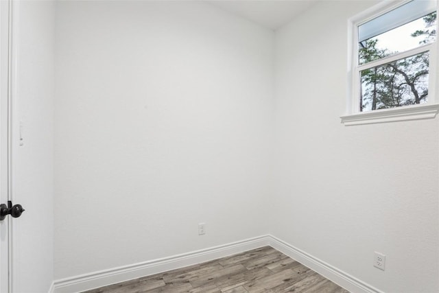 spare room featuring light hardwood / wood-style floors