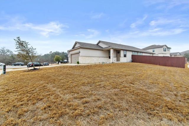 exterior space featuring a garage and a yard