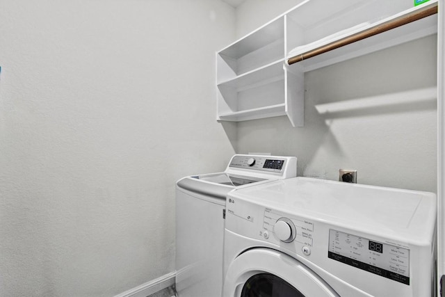 clothes washing area featuring washing machine and dryer